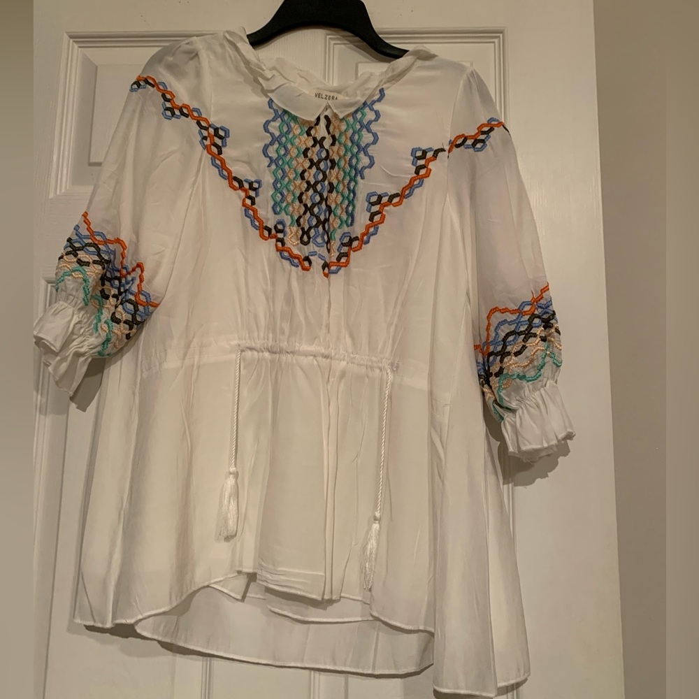 White shirt with multi colored designs
